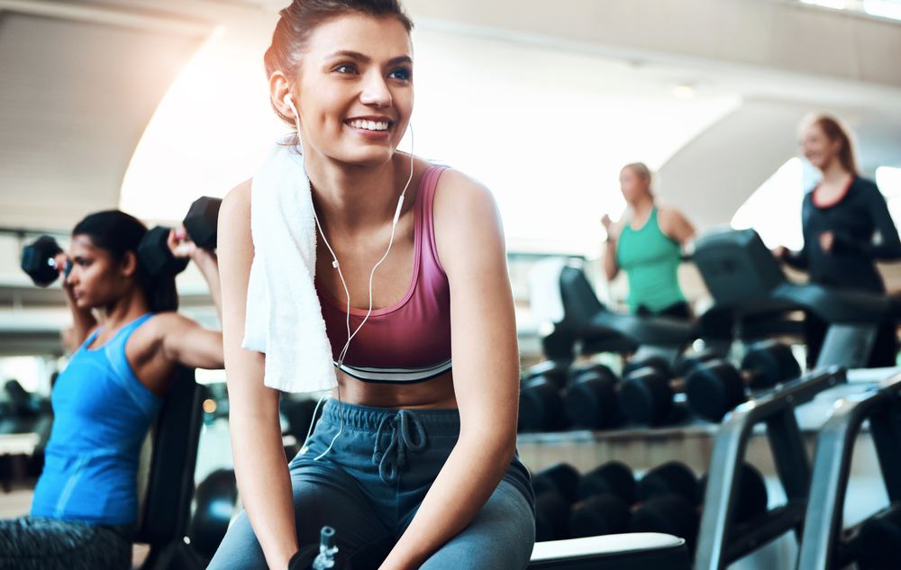 Woman relaxing after a workout at the fitness center