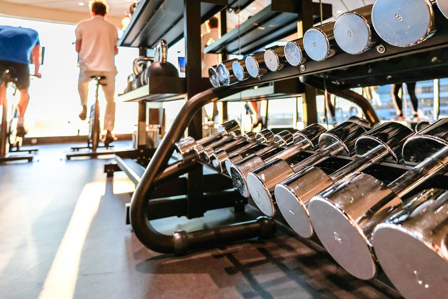 Bright modern gym interior with equipment